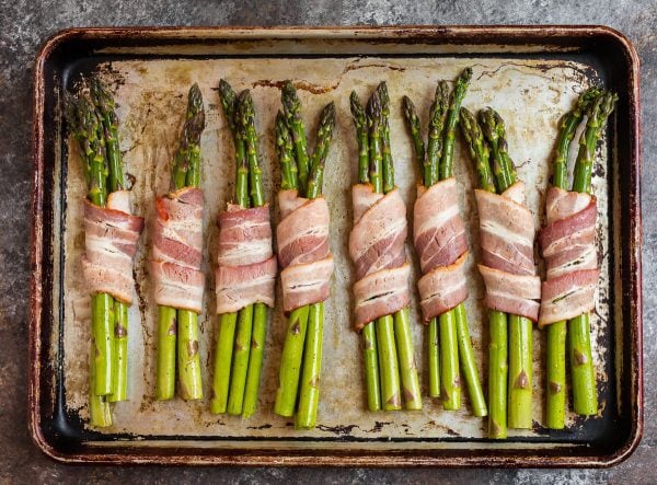 Bacon Wrapped Asparagus on a baking sheet before baking