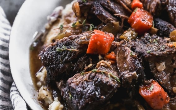 braised beef served over mashed potatoes