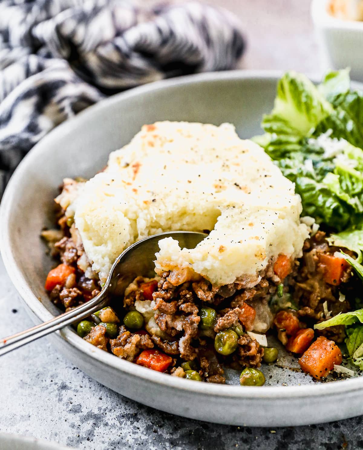 a slice of easy shepherd's pie with a hearty ground meat filling and mashed potato topping