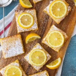 The BEST Lemon Bars recipe! Lusciously creamy and bursting with bright lemon, these easy lemon squares with shortbread base take less than 10 minutes to prep and always wow the crowd.