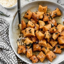 the best sweet potato gnocchi recipe on a plate with sage butter sauce