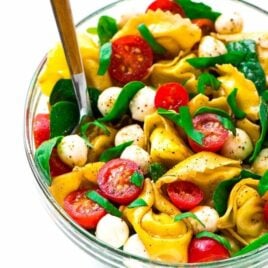 Caprese Pasta Salad with balsamic, tortellini, and fresh basil. The perfect combination of flavors. A fresh and healthy cold pasta salad that’s great for summer appetizers, sides, and light dinners. Easy recipe that’s ready in 15 minutes! Recipe at wellplated.com | @wellplated