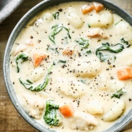 a bowl of creamy copycat olive garden chicken and gnocchi soup