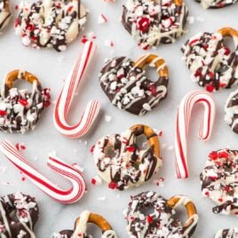 How to make easy Dark or White Chocolate Covered Pretzels with Peppermint. The perfect recipe for Christmas, Thanksgiving, and homemade holiday gifts! Simple, festive, and fun. The sweet-salt combo is complete addictive!