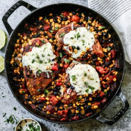 A cast iron skillet with cowboy chicken
