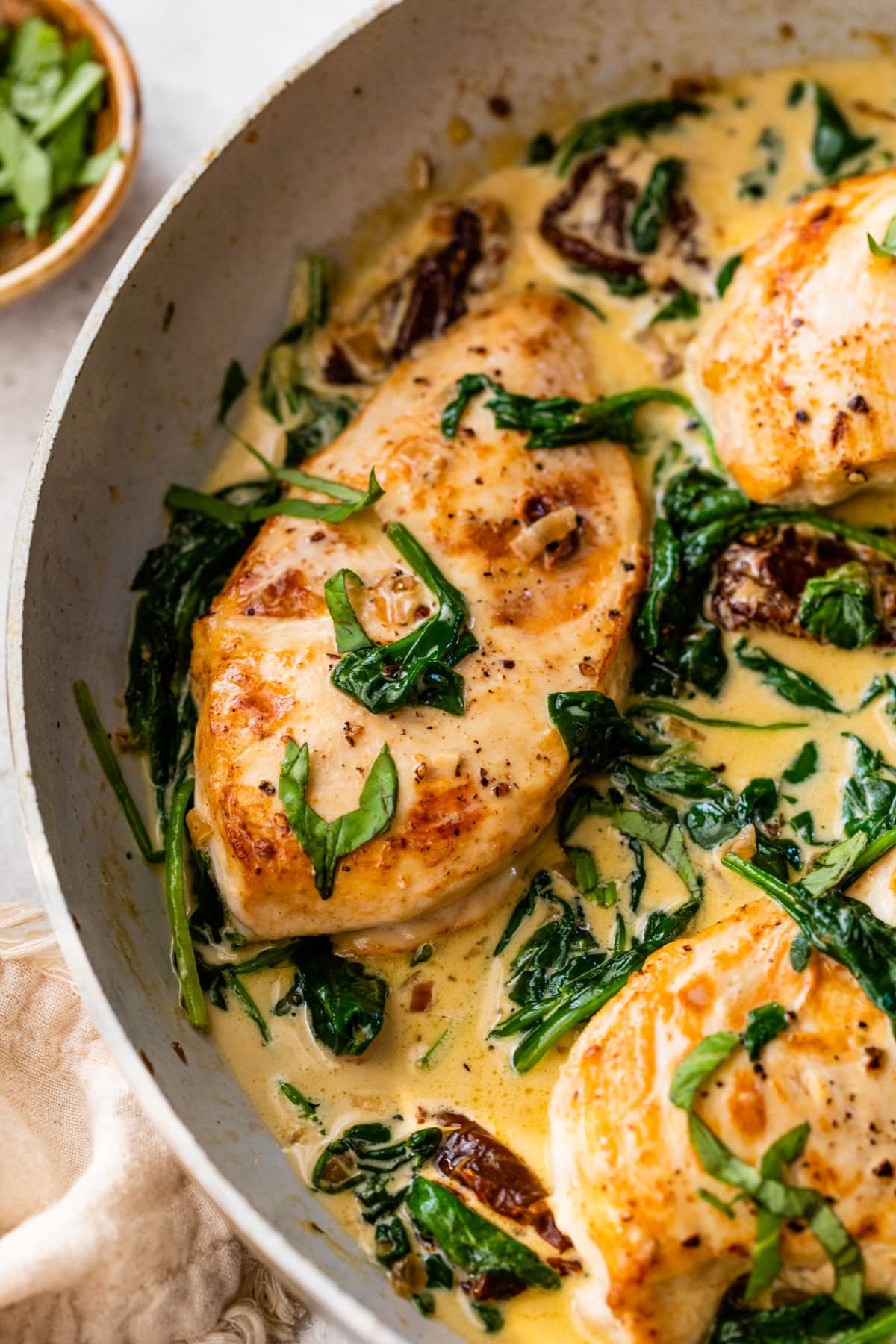 creamy tuscan chicken on the stove