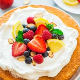 Flourless Lemon Almond Cake with Fresh Berries – a light, fluffy, and gluten free dessert made with almond flour, eggs, and sugar. Simple, low carb, and perfect for any holiday or party! Recipe at wellplated.com | @wellplated