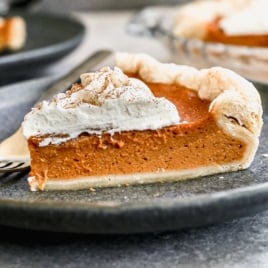 a slice of Grandma's old fashioned sweet potato pie with marshmallow whipped cream