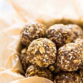 No Bake Ginger Cookie Healthy Energy Balls — easy, high protein, and great for your skin! Raw vegan recipe with oatmeal, coconut, warm spices, and flaxseed. Naturally sweetened and no food processor required! Recipe at wellplated.com | @wellplated