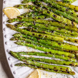 Grilled asparagus with lemon and Parmesan on a plate