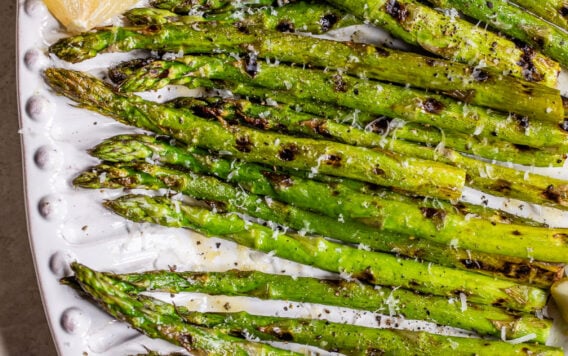 Grilled asparagus with lemon and Parmesan on a plate
