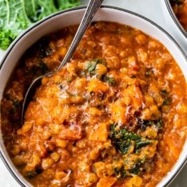 a bowl of lentil soup with a spoon