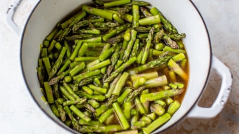 tender fresh asparagus in a Dutch oven for soup