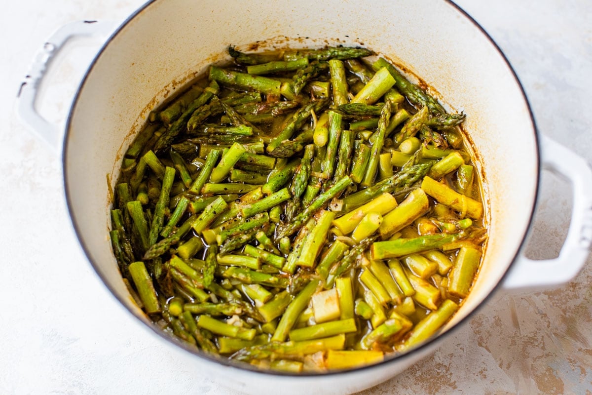 making healthy asparagus soup in a large pot