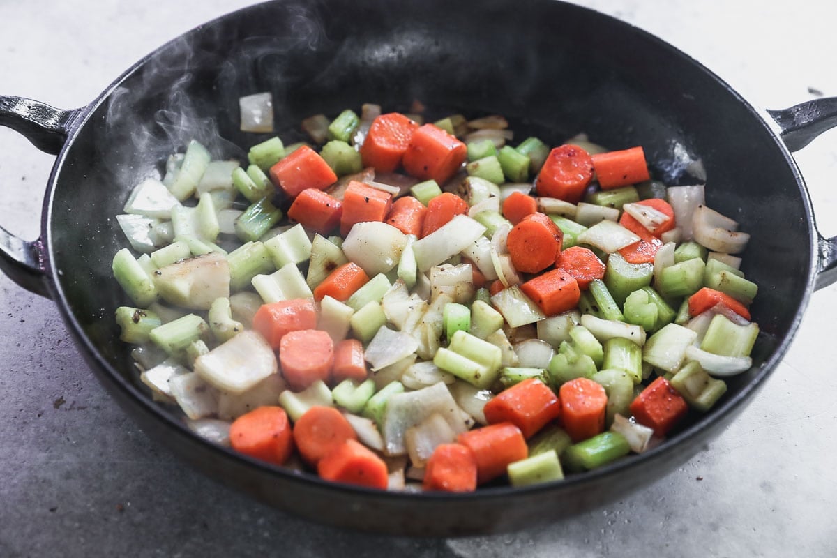 vegetables cooking in pan for braised beef
