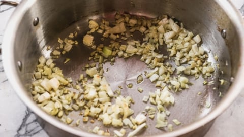 cooking onions in pot for cauliflower soup