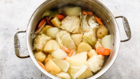 cabbage and vegtables in a large pot for classic corned beef recipe