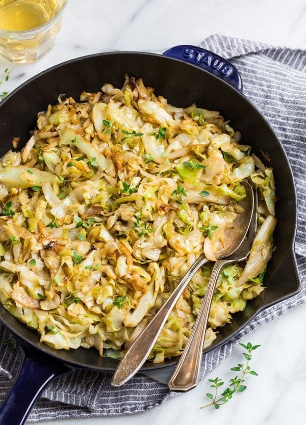 Sauteed Cabbage served in a skillet that's good for you and can be served with onion and carrots