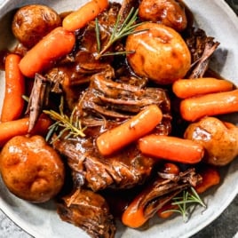 instant pot roast with carrots and potatoes on a plate