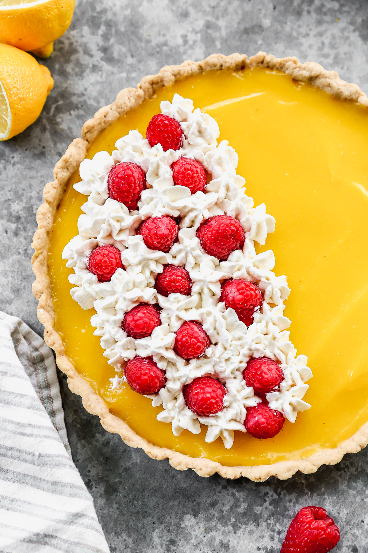 easy lemon tart with berries and cream topping