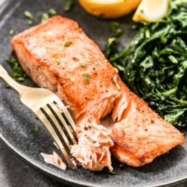 moist and flaky pan seared salmon on a plate