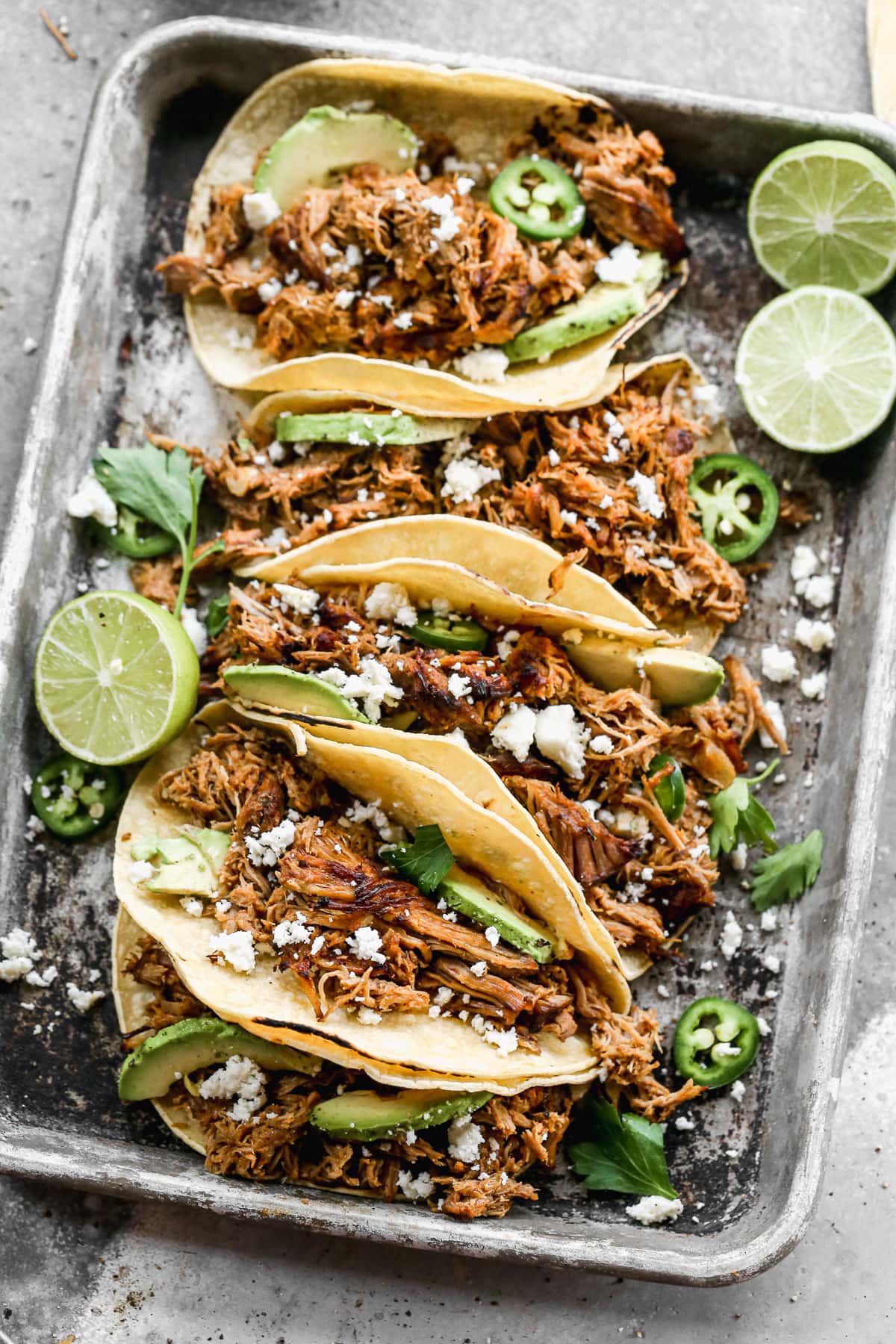 A serving tray with slow cooker pork carnitas
