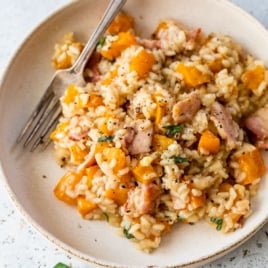 a plate of risotto with roasted butternut squash