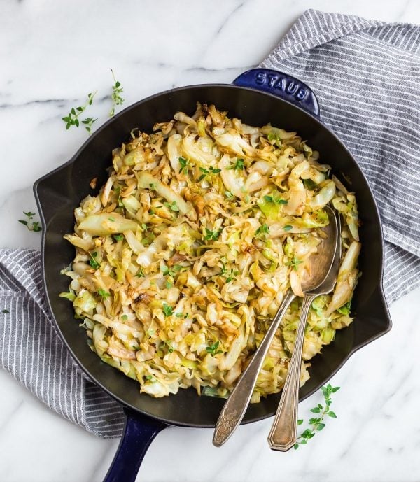 Good for you Sauteed Cabbage in a skillet that can be served for dinner with onion and carrots