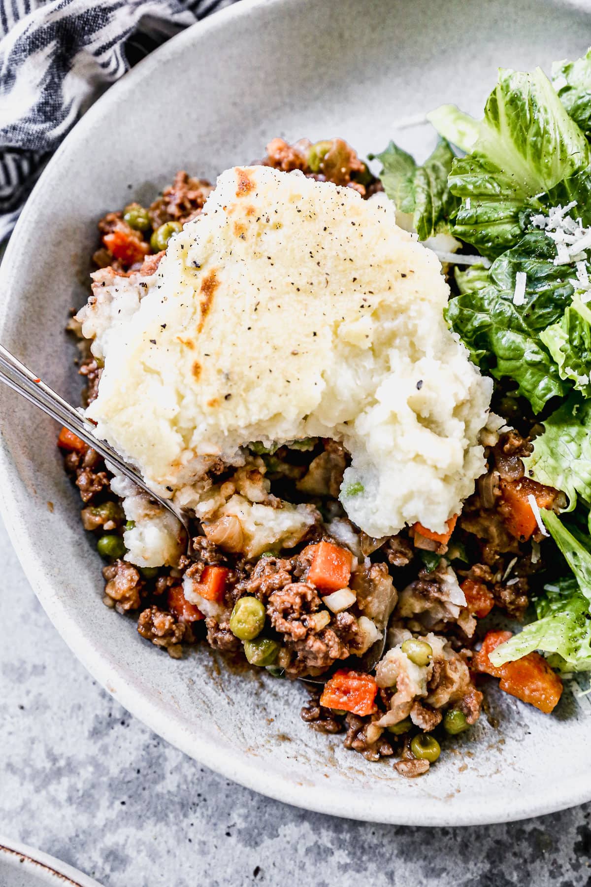 Easy shepherd's pie on a plate with lettuce