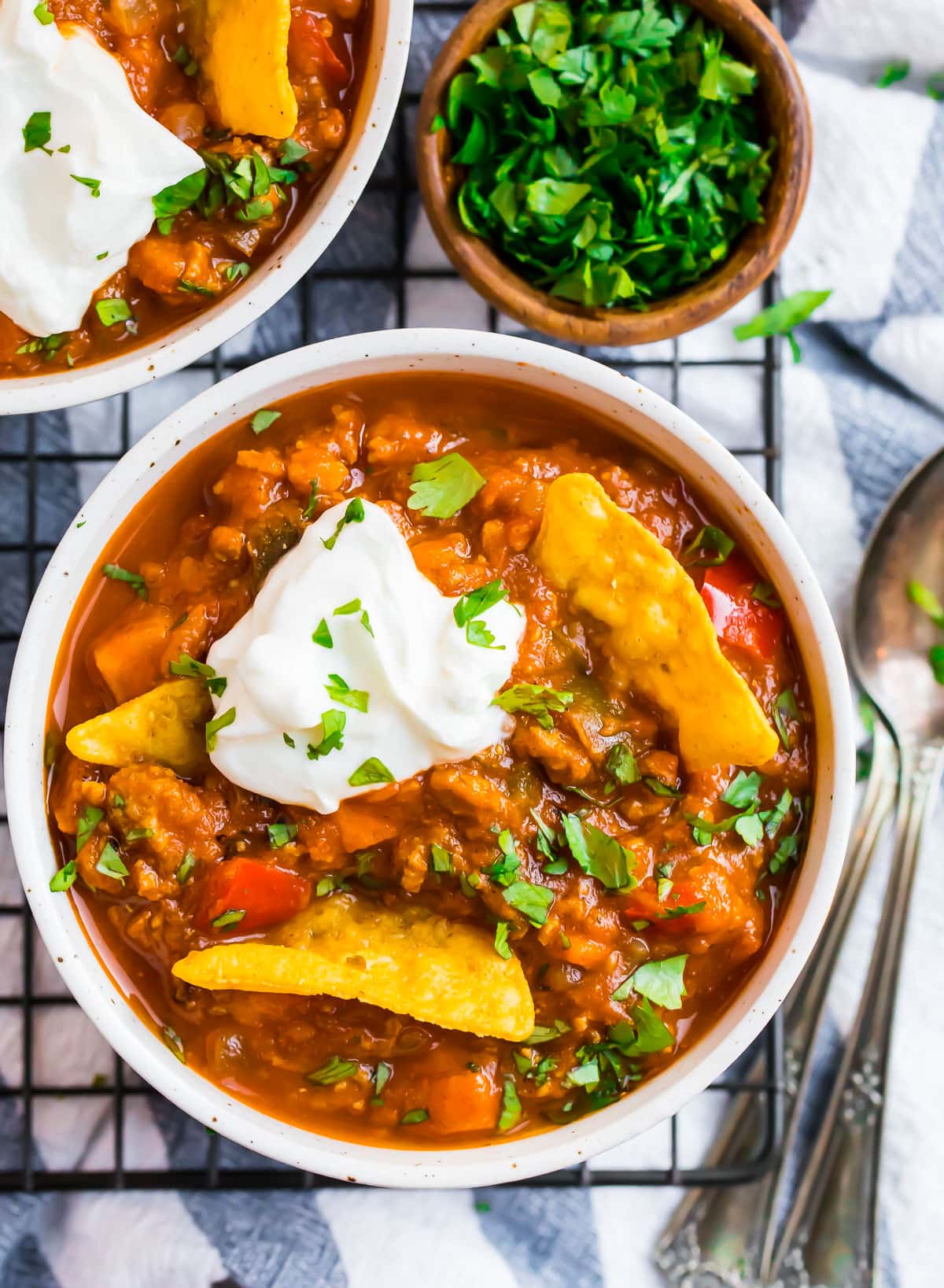 A bowl of turkey pumpkin chili with chips