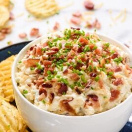 You will not be able to stop eating this Loaded Baked Potato Dip! With bacon, sour cream, and cheese, this creamy, delicious dip is the best football food!